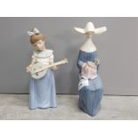 Nao by Lladro figure of a girl playing an instrument and a Lladro nun 5501 (missing fingers).