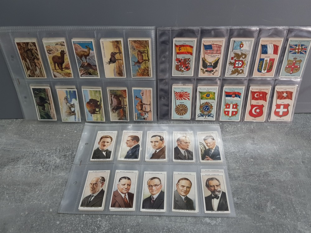 3 full sets of cigarette cards, Wills Radio celebs, John player and sons flags and Natural