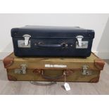 A military canvas and leather bound suitcase by Papworth Industries dated 19686 67cm wide, and