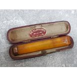 Cheroot holder in bakelite with 9ct gold rim, (damaged repaired) with original case