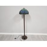 A metal Tiffany style standard lamp with dragonfly decoration shade 160cm high.