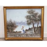 An oil painting by C Manning, Lady by a Lake, signed 50 x 60cm.