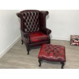 Red leather Wingback button back arm chair and matching foot stool in good condition