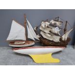 A wooden model of a galleon 'revenge', a model of a yacht and a wooden lake boat