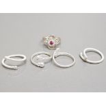 Five silver rings, one with pink stone, size I approx, 9g gross.