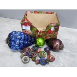 Box of antique Kugel Christmas tree ornaments together with ten tin antique christmas candle clips