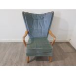 A retro beech framed open armchair upholstered in blue fabric.