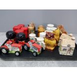 A tray containing novelty salt and pepper shakers to include tractors beer steins etc