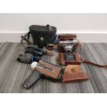 A pair of swift 8x30 binoculars 2 vintage Kodak cameras etc