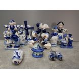 Box of blue and white delft ornaments to include windmill figured couple etc