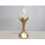 A 20th century brass oil lamp and hand blown glass reservoir, with mark to base 21cm.