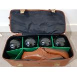 A Mitre bag containing boules and a pair of shoes.