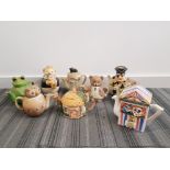 a collection of 9 novelty teapots