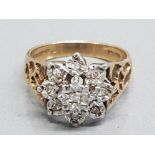 A 9ct yellow gold and diamond cluster ring, illusion settings, size N, 4.1g gross.