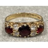 Ladies 9ct gold Garnet and white stone ring. Size P 2.1g