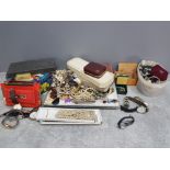 A large quantity of costume jewellery, buttons and wristwatches.