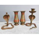 Garniture of pair of enamelled brass vases and pair of enamelled brass cobra candlesticks