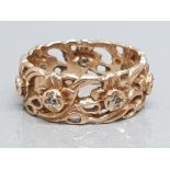 A 14ct yellow gold and diamond eternity ring of unusual design, 6.5g gross.