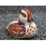 A Royal Crown Derby duckling paperweight with gold stopper.