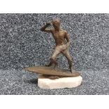 Bronze figure of a surfer on a marble base + signed with initials on board from Bonhams Sept 2020