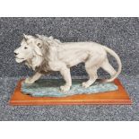 Large Lion sculpture mounted on wooden base