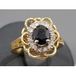 Ladies 18ct yellow gold sapphire and diamond ring, featuring a blue sapphire in the centre