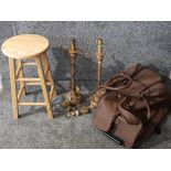 A pair of table lamps, a stool and a leather travelling case.