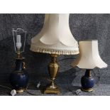 Three table lamps of various designs.