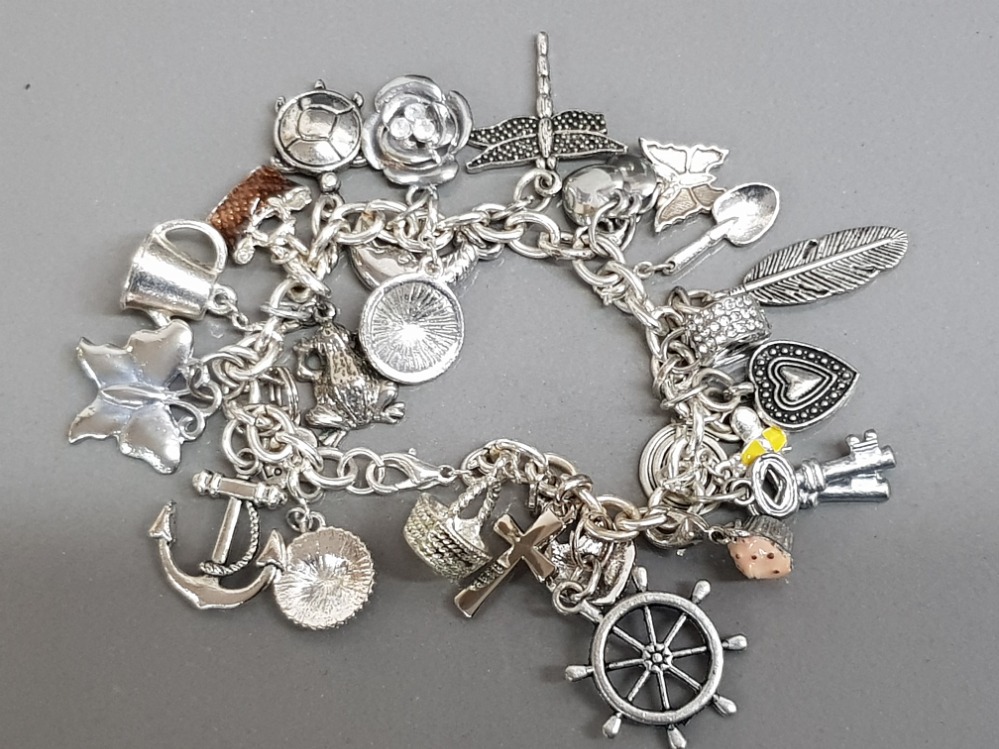 Silver plated charm bracelet, 25 charms in total