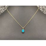 Ladies 9ct gold turquoise stone pendant and chain.