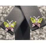 Ladies 9ct white gold Butterfly stud earrings. Comprising of 2 Peridots and 2 Pink tourmaline