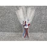 Nine champagne flutes, glasses with mixed colour stems and flute holder vase.