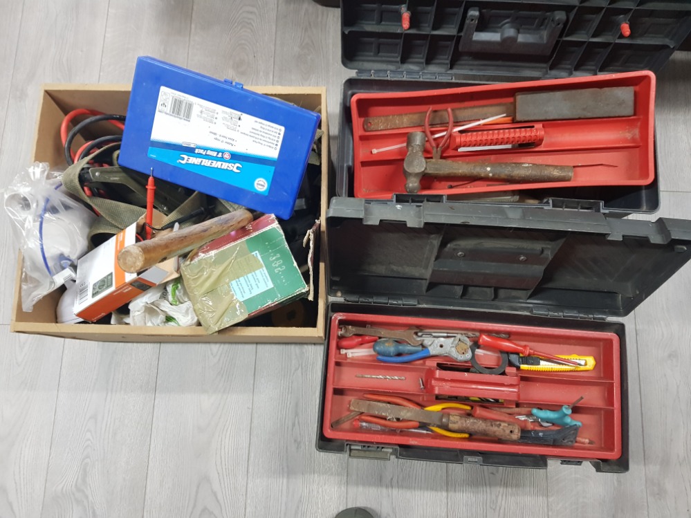 A quantity of tools in two tool boxes and another.