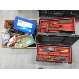 A quantity of tools in two tool boxes and another.