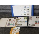 2 albums of stamps from around the world together with album of first day covers
