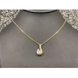 Ladies 9ct gold stone set pendant and chain. Comprising of a single CZ stone and diamond cut Belcher