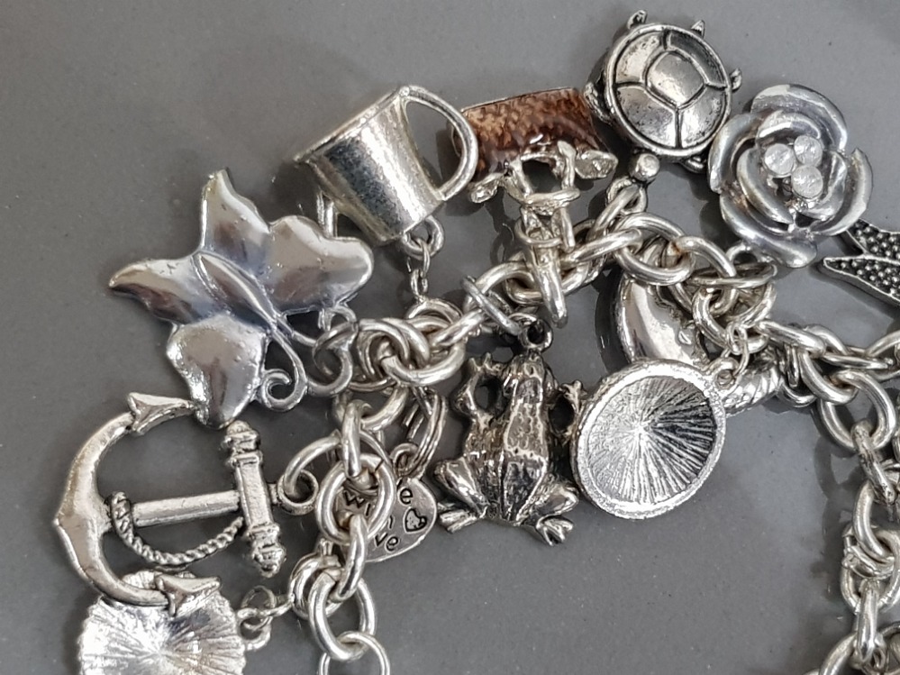 Silver plated charm bracelet, 25 charms in total - Bild 3 aus 3