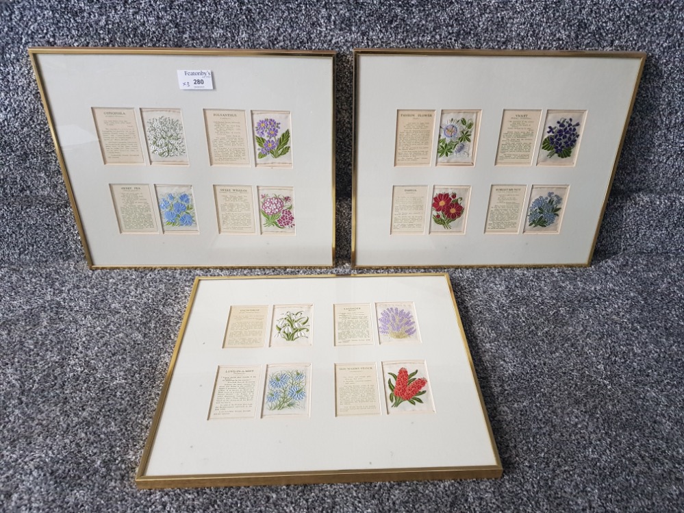 Framed silks depicting flowers. 3