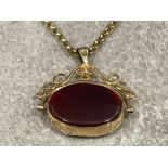 Ladies 9ct gold fob pendant and chain. Featuring a 2 sided fob set with brown and black stone.