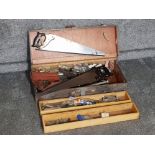 Vintage wooden tool chest containing mixed vintage handtools, including saws, drill bits, Stanley