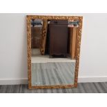 Gilt framed bevelled edge mirror, autumn leaf design in frame, 69x100cm