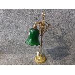 A brass library/desk lamp with green glass shade 55cm high.