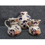 A large masons ginger jar together with 2 masons jugs all in the mandarin pattern