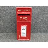 Large cast metal post office box in red, with keys