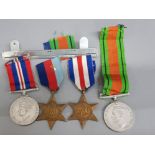 Set of 4 WW2 medals includes 1939-1945 defence medal, the France and Germany star plus the 1939-1945