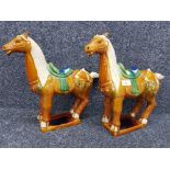 A pair of glazed terracotta Chinese horses 37cm high.