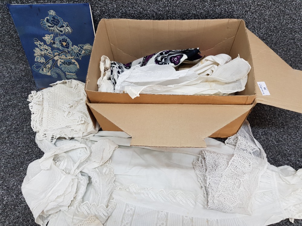 Box containing miscellaneous victorian christening gowns, oriental fabric and materials etc