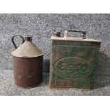 A vintage Esso jerry can and another.