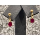 Ladies 9ct gold Ruby drop earrings. Set with a pear shaped stone