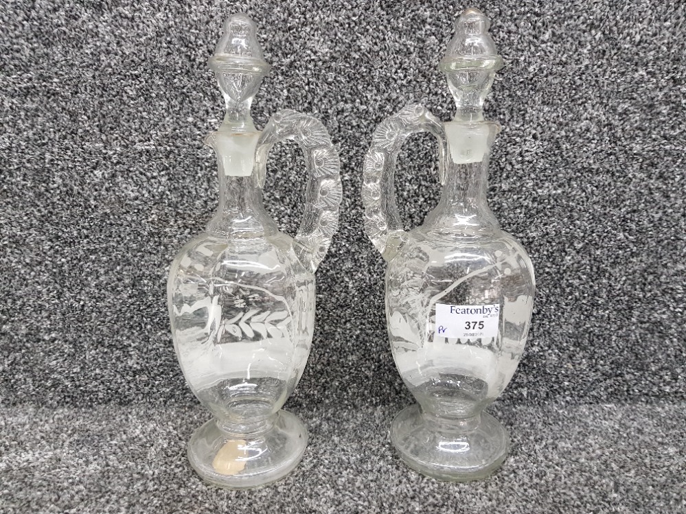 A pair of Victorian glass claret jugs with enamelled decoration 31cm high. - Bild 2 aus 3